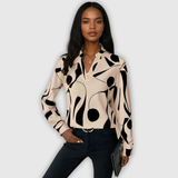 Елегантна блуза с дълги ръкави и остър деколте